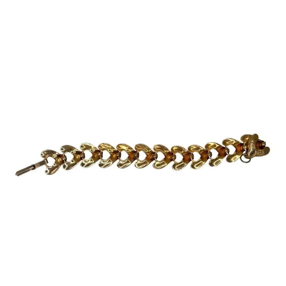 Unmarked gold colored link heart bracelet